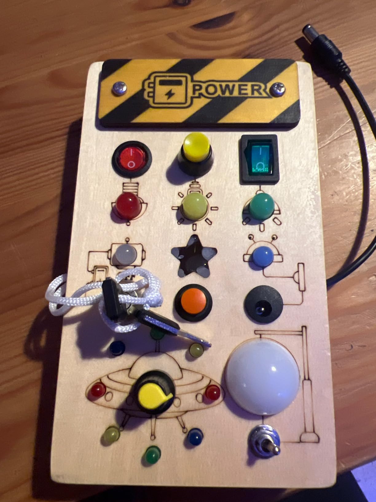WEARXI Busy Board Holzoptik LED Dinosaurier Sound